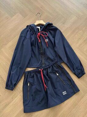 This Miu Miu trench coat features exquisite